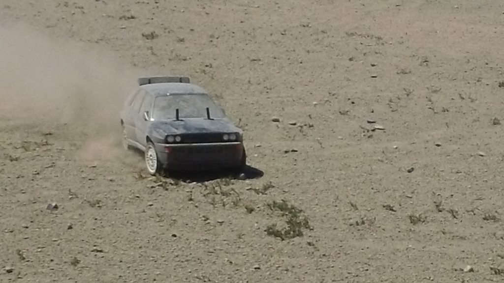 XV-01 super dirty as it goes fast across loose dirt