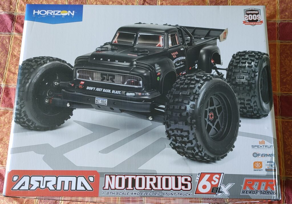 The box for an ARRMA Notorious 6S BLX RC car with a black body. 